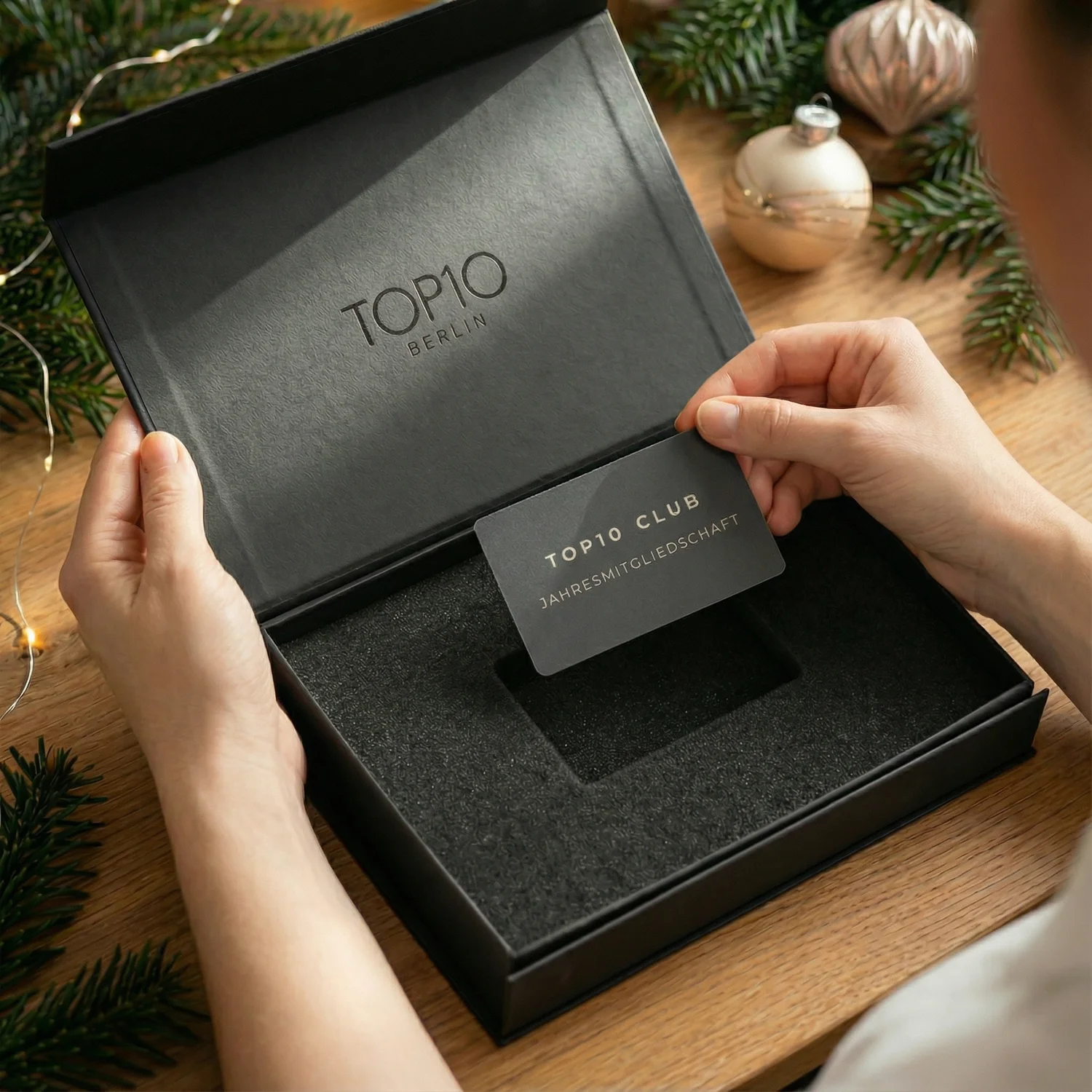 Top10 Experience Box Open with gift card in hand