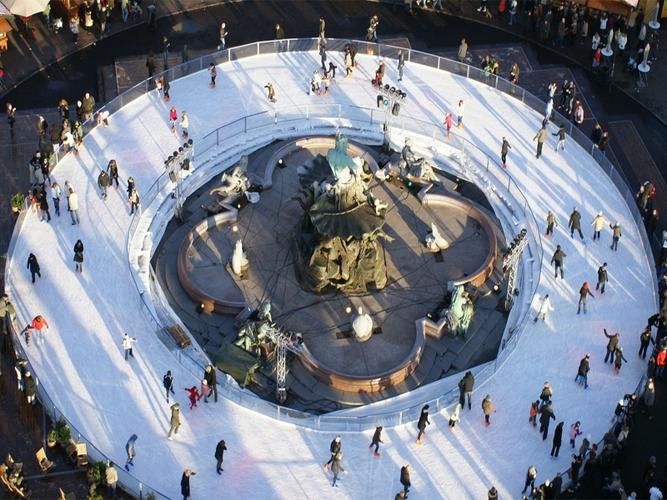 Ice Skating in the Neptune Fountain on Alexanderplatz