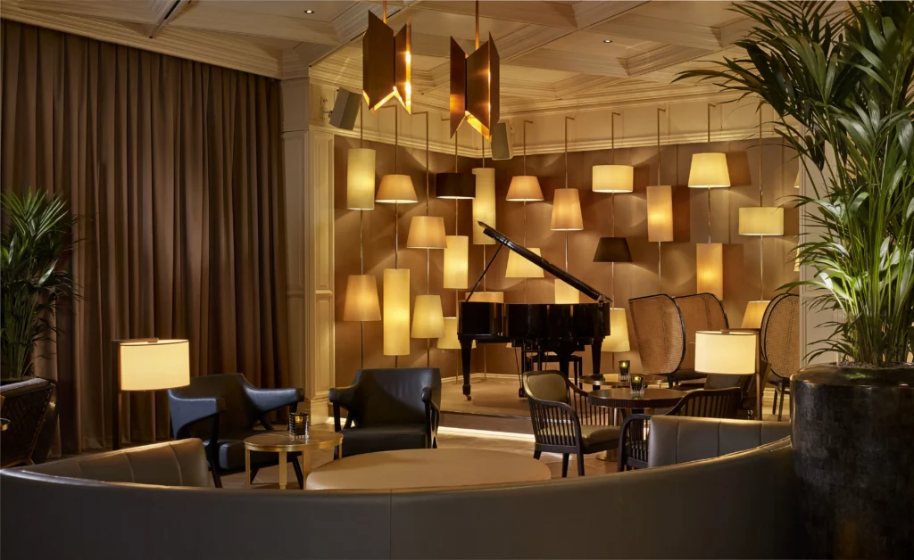 Interior of The Curtain Club at The Ritz-Carlton, Berlin Mitte, showcasing its elegant decor and cozy ambiance.