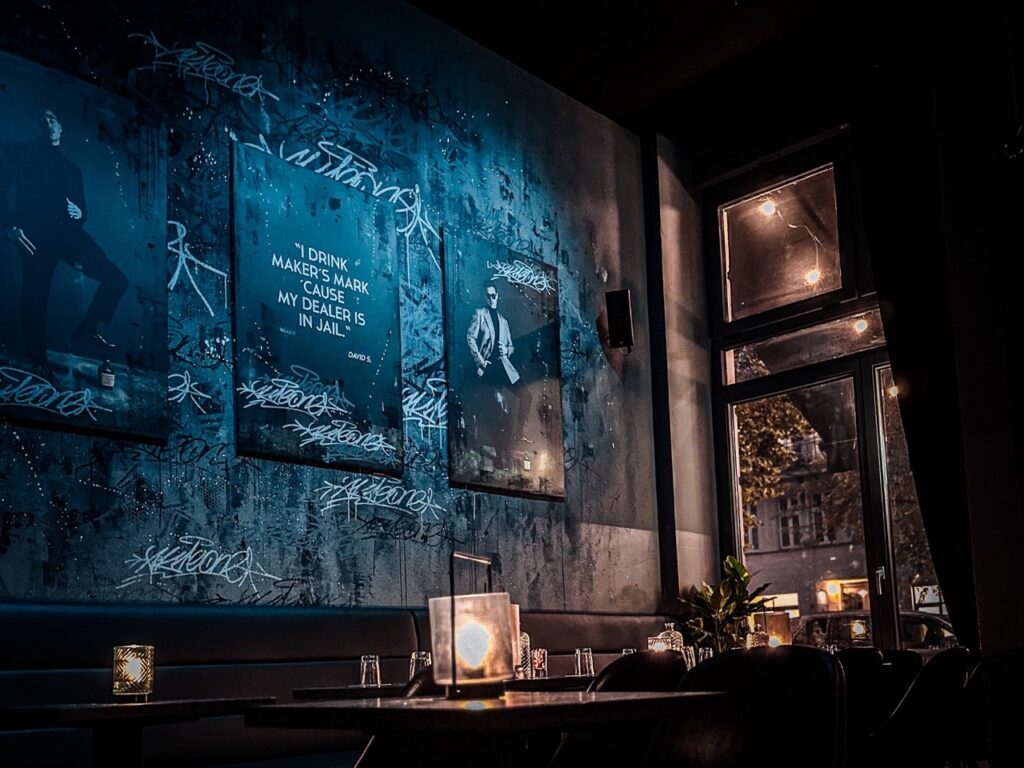 Cozy interior of Wash Bar in Berlin Mitte, featuring communal seating and washing machines in the background.